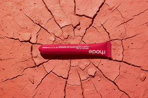 Rhode Peptide Lip Tint – Red Pink Tube Coral Background